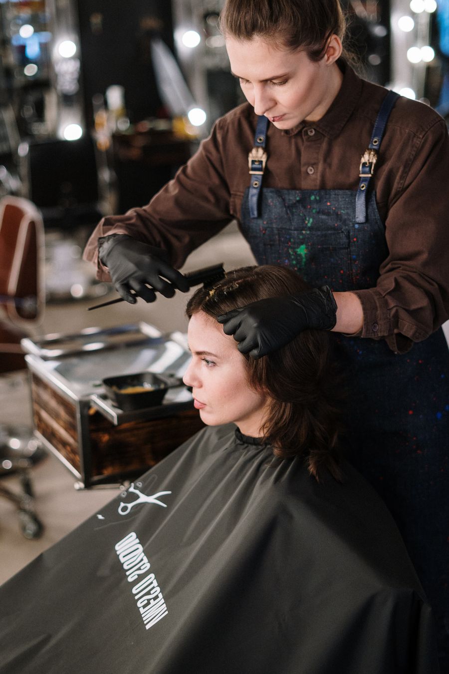 Stylist talking with a client before a cut