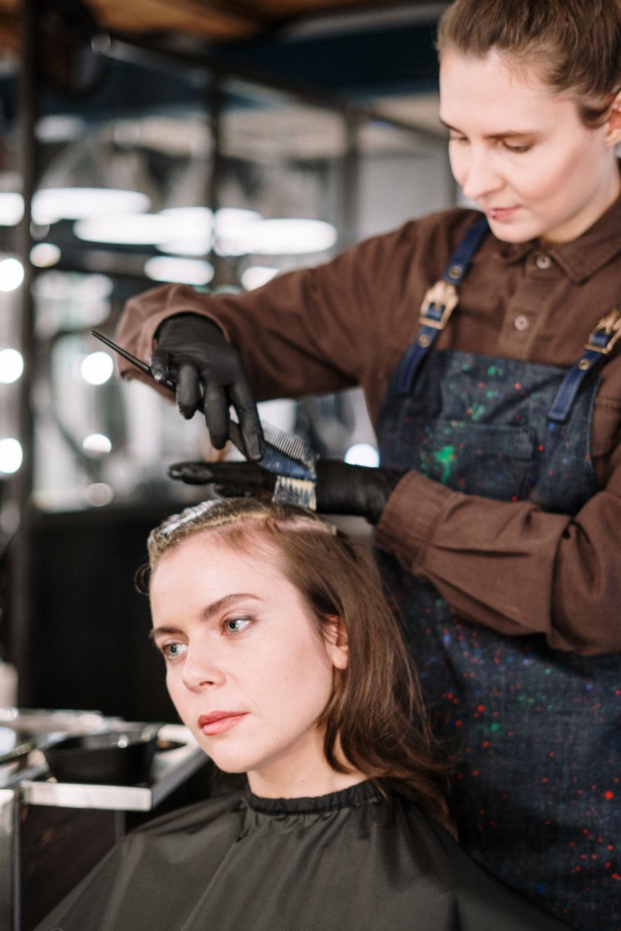 Hairdresser cutting a woman's hair